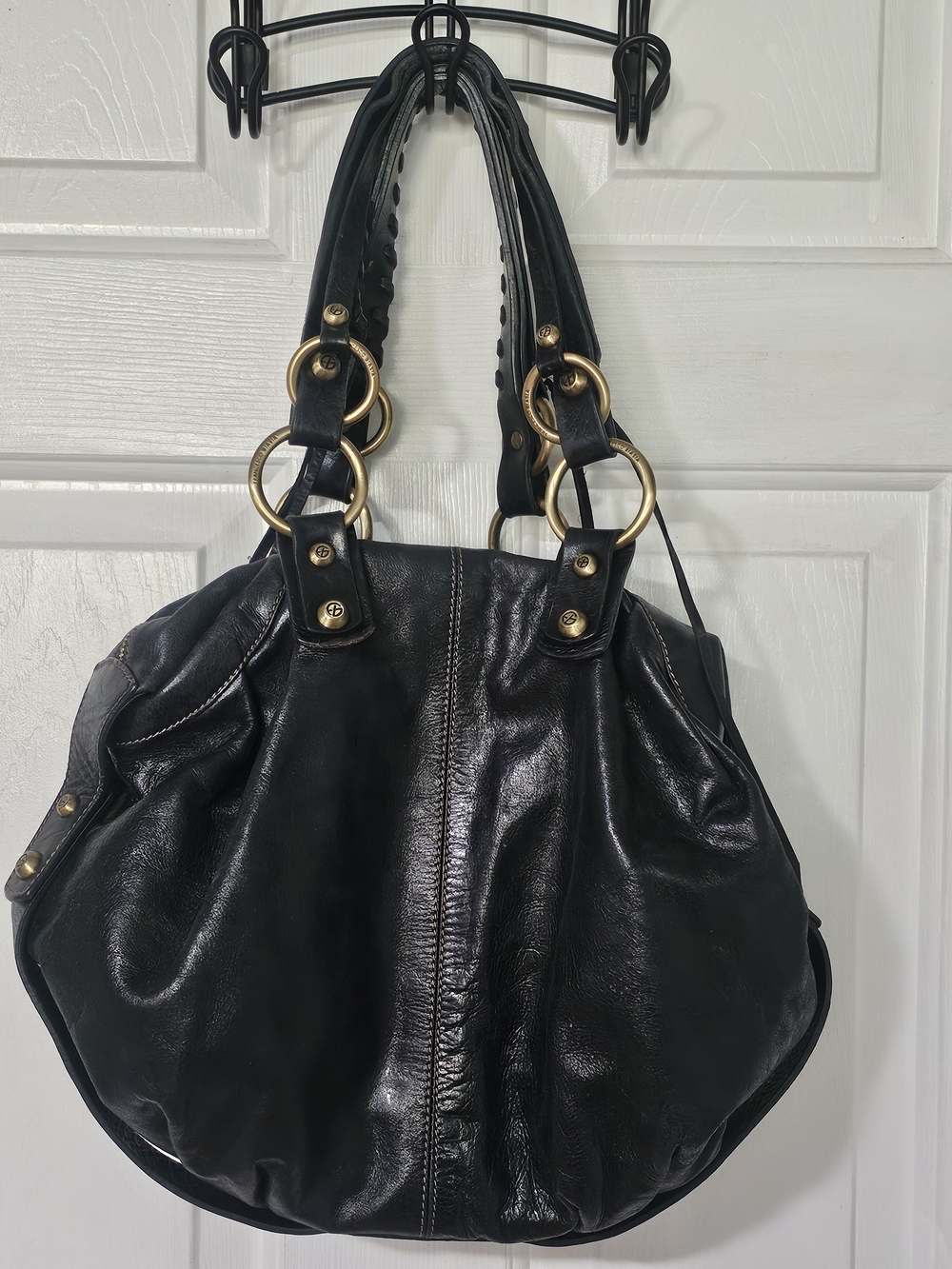 Black Leather Shoulder Bag with Gold Ring Accents